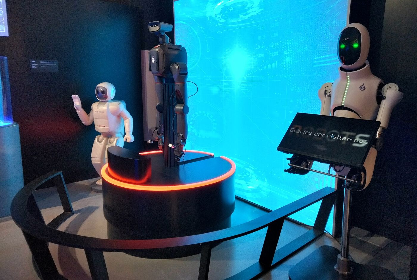 Humanoid robots on display at a technology exhibition.