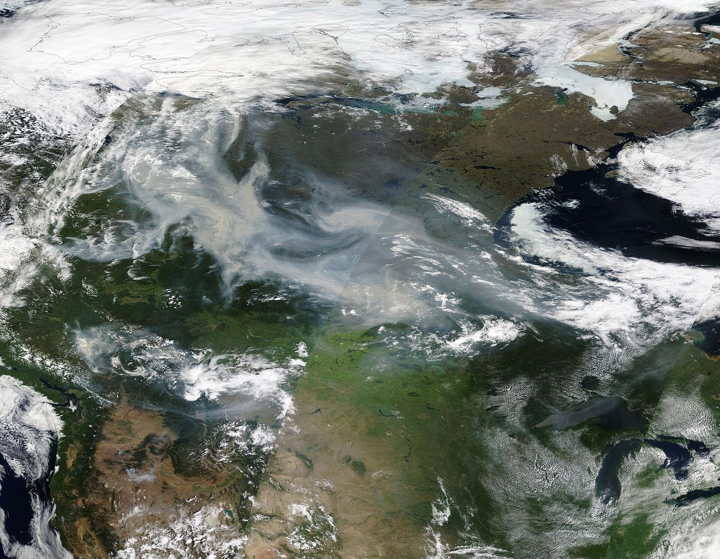 Smoke rises from the boreal forest north of Prince Albert, Saskatchewan, during the last major fire of the season in late September.