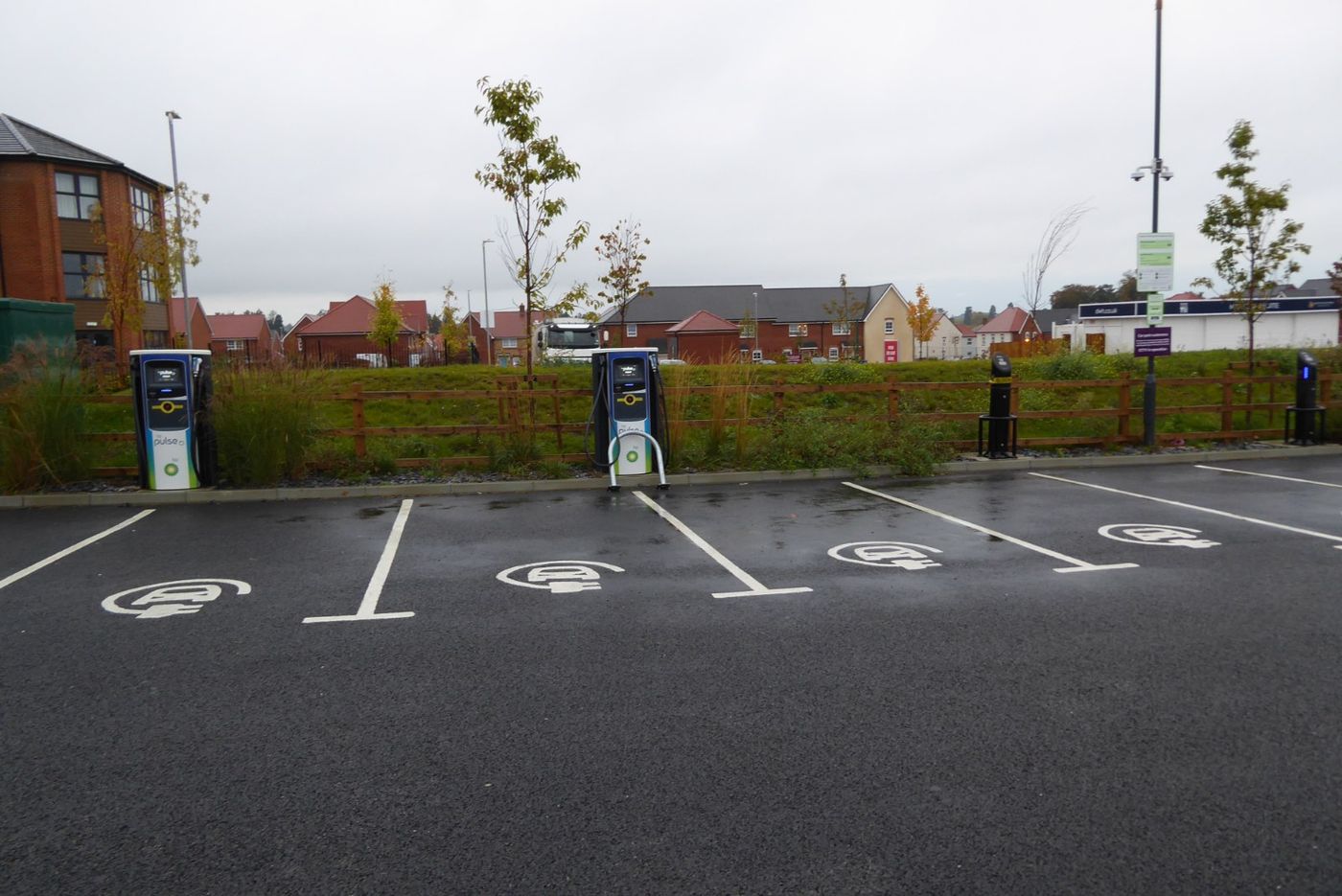 Electric vehicles charge at a station in a parking lot outside Milan. Used E.V. prices in Europe have risen for three consecutive quarters.