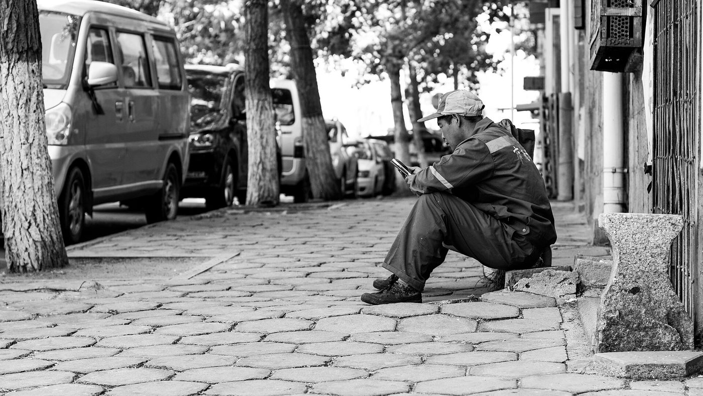 A teenager looks at a smartphone in Copenhagen. Denmark is one of five E.U. countries beginning mandatory age verification for social media this month.
