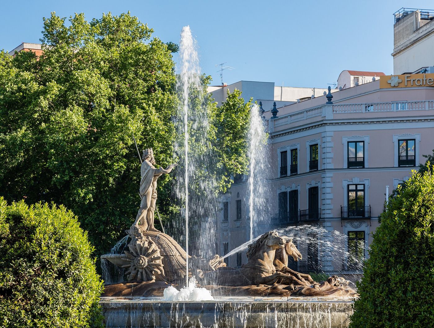 People cool off at a fountain in central Madrid during a late-August heat wave.