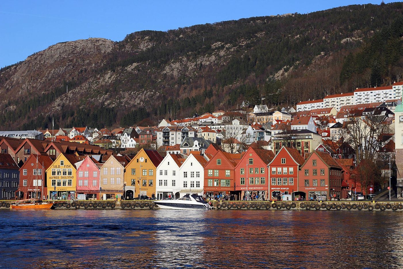 The wooden warehouses of Bryggen in Bergen, Norway, where the fictional Solveig Brekke keeps her husband’s accounts in “The Salt Ledger.”
