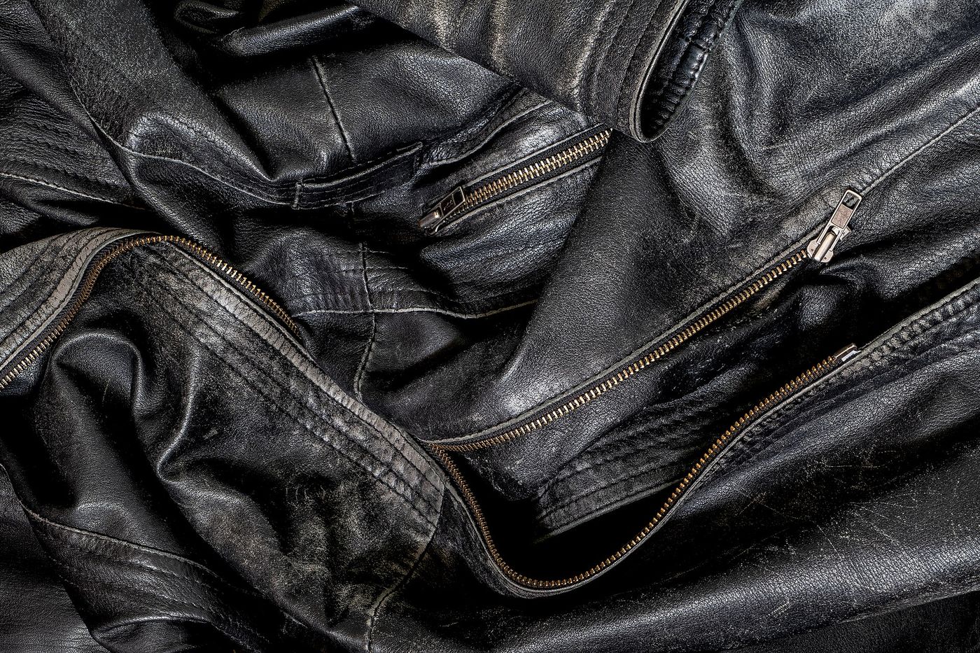 A tailor hand-stitching a jacket canvas in a workshop. Milan’s bespoke trade has a waiting list and a shortage of hands.